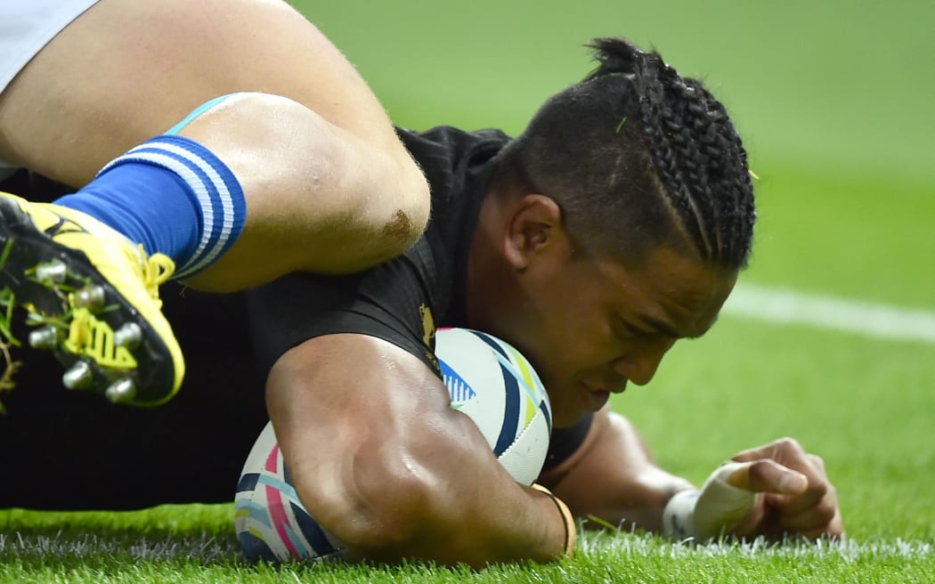 The All Blacks wing Julian Savea scores one of his two tries against Namibia.