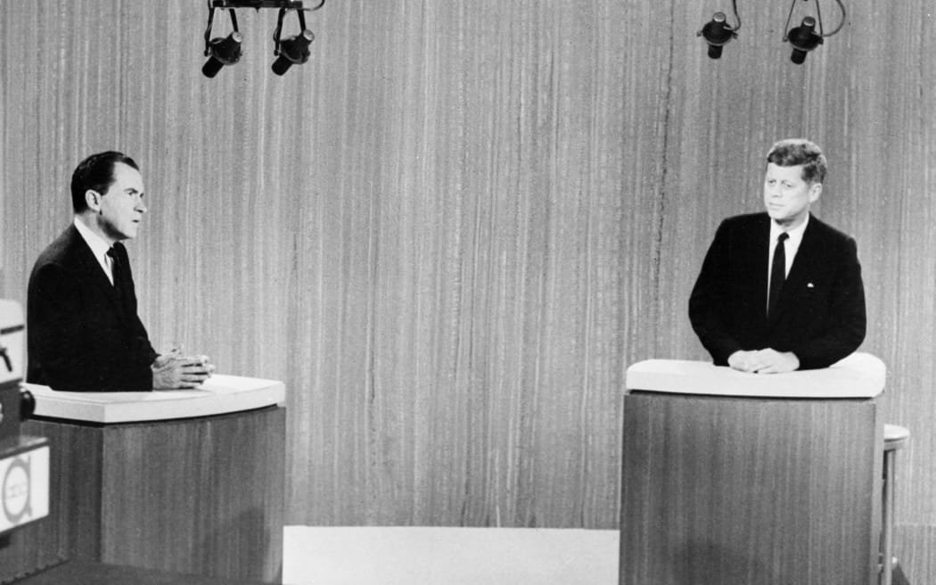 (FILES) Presidential candidates Vice President Richard Nixon (L) and Senator John Kennedy (R) face off in the final televised debate on September 26, 1960 in a Chicago television studio. This was the first televised debate of its kind - in black and white - and it established the role of the image. After two terms as Dwight Eisenhower's vice-president, Republican Richard Nixon appeared to be the favorite in the election. But in front of over 66 million viewers, he appeared pale - he had refused to wear make-up - unshaven and sweaty, while the young senator from Massachusetts, John F. Kennedy, was tanned and relaxed. When he speaks, the Democrat systematically looks at the camera, and therefore at the voter, while Nixon addresses the moderator. (Photo by AFP)