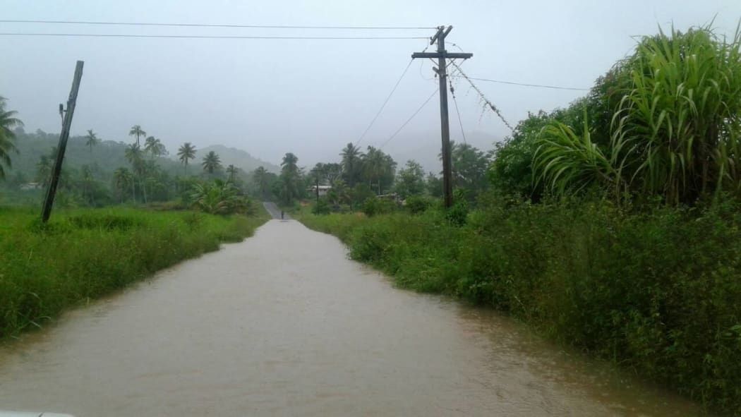 A road is closed because of flooding