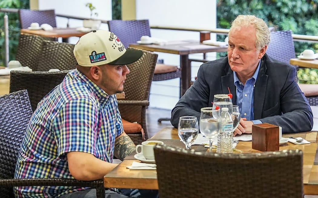 Picture obtained from the X account of Salvadorean President Nayib Bukele, @nayibbukele, showing US Senator Chris Van Hollen (R) holding a meeting with Salvadoran migrant Kilmar Abrego Garcia, a US resident wrongfully deported to his home country, at a hotel in San Salvador on April 17, 2025. Van Hollen met with Salvadoran Abrego Garcia, whose wrongful deportation has triggered a political firestorm over President Donald Trump's hard-line immigration policies. Abrego Garcia was detained in Maryland last month and expelled to El Salvador along with 238 Venezuelans and 22 fellow Salvadorans who were deported shortly after President Donald Trump invoked a rarely-used wartime authority. (Photo by X account of El Salvador's President Nayib Bukele / AFP) / RESTRICTED TO EDITORIAL USE - MANDATORY CREDIT "AFP PHOTO / X ACCOUNT OF EL SALVADOR'S PRESIDENTNAYIB BUKELE" - NO MARKETING NO ADVERTISING CAMPAIGNS - DISTRIBUTED AS A SERVICE TO CLIENTS