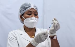 A health worker praparing a dose of COVID-19 vaccine, at a vaccination centre in Guwahati, India on 05 May 2021.