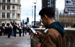 pedestrian smartphone footpath street