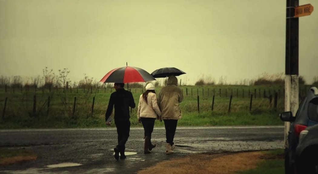 Mourners walking to urupā