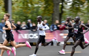 Kenya's Eliud Kipchoge (white jersey) runs during his attempt to bust the mythical two-hour barrier for the marathon on October 12 2019 in Vienna.
