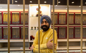 Ravindra Singh, owner of Ravi Jewellers, says the metal cages inside his store create anxiety for customers.