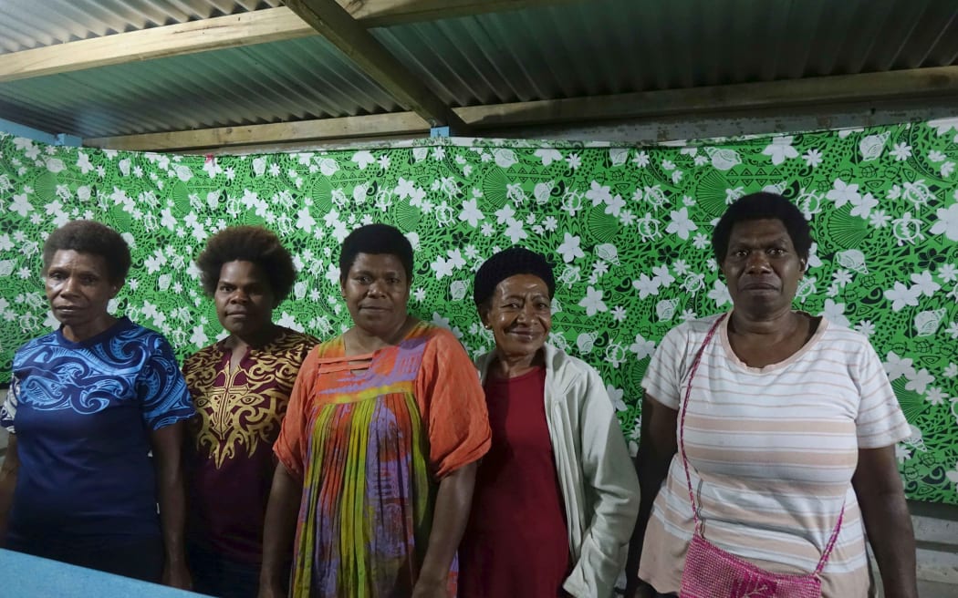 Owners of businesses at the 20 Vatu market.
