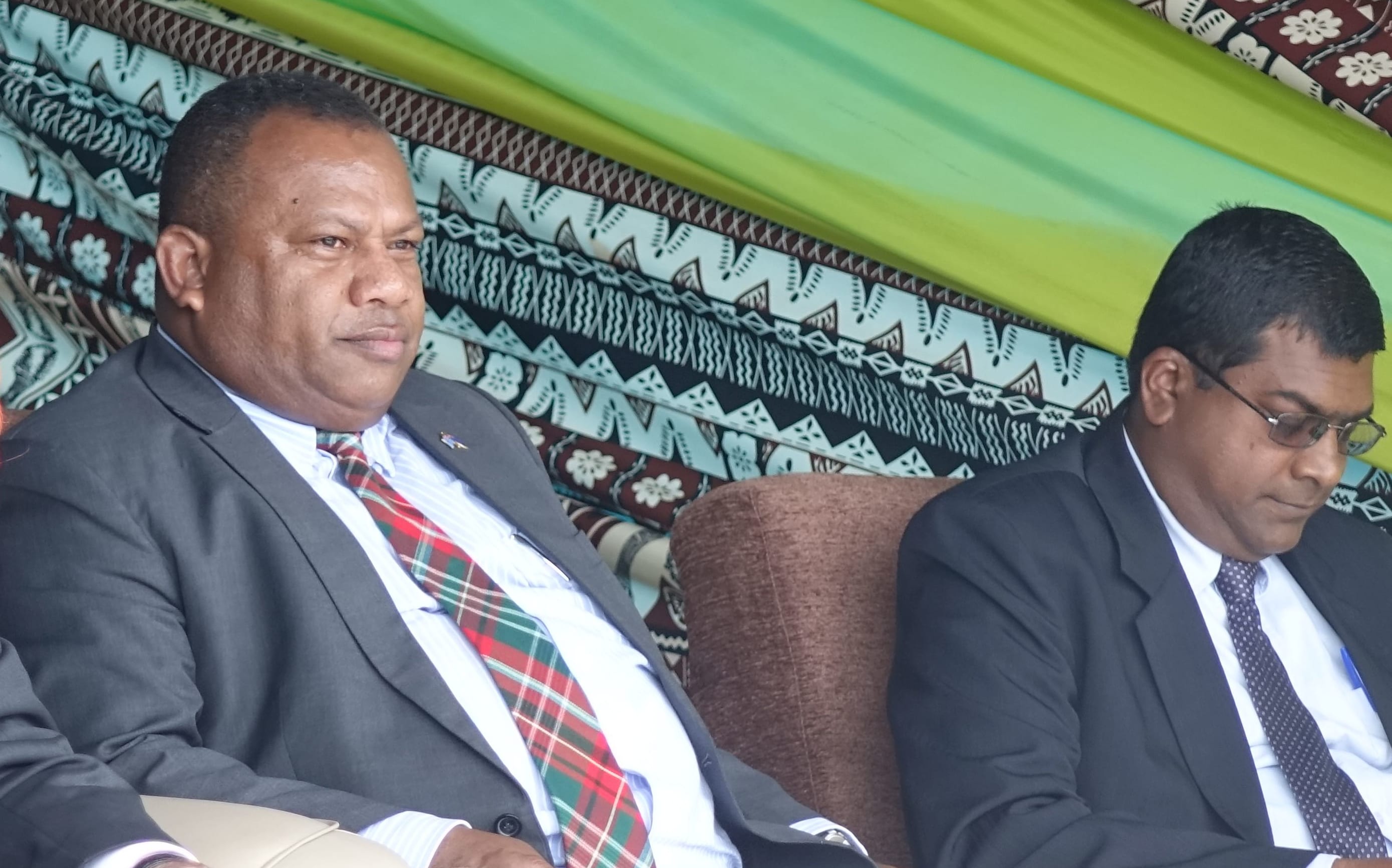 Fiji government minister Inia Seruiratu, seated next to New Zealand's prime minister John Key.