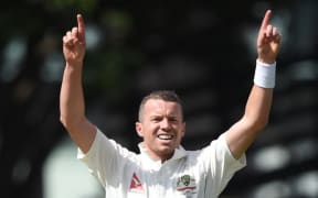 Australian bowler Peter Siddle celebrates the dismissal of Kane Williamson