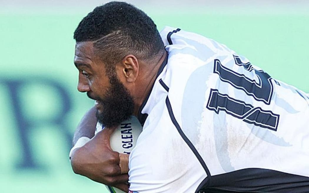 Fiji's Waisea Nayacalevu dives over to score.