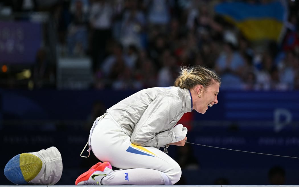 Ukraine's Olga Kharlan celebrates after winning against South Korea's Choi Se-bin in the women's sabre individual bronze medal bout during the Paris 2024 Olympic Games at the Grand Palais in Paris, on July 29, 2024. (Photo by Fabrice COFFRINI / AFP)