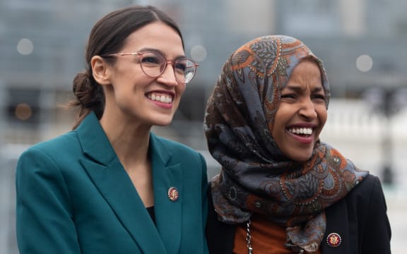 File photo of Representative Alexandria Ocasio-Cortez, and Ilhan Omar (R) - two of the members of Congress President Trump has attacked.