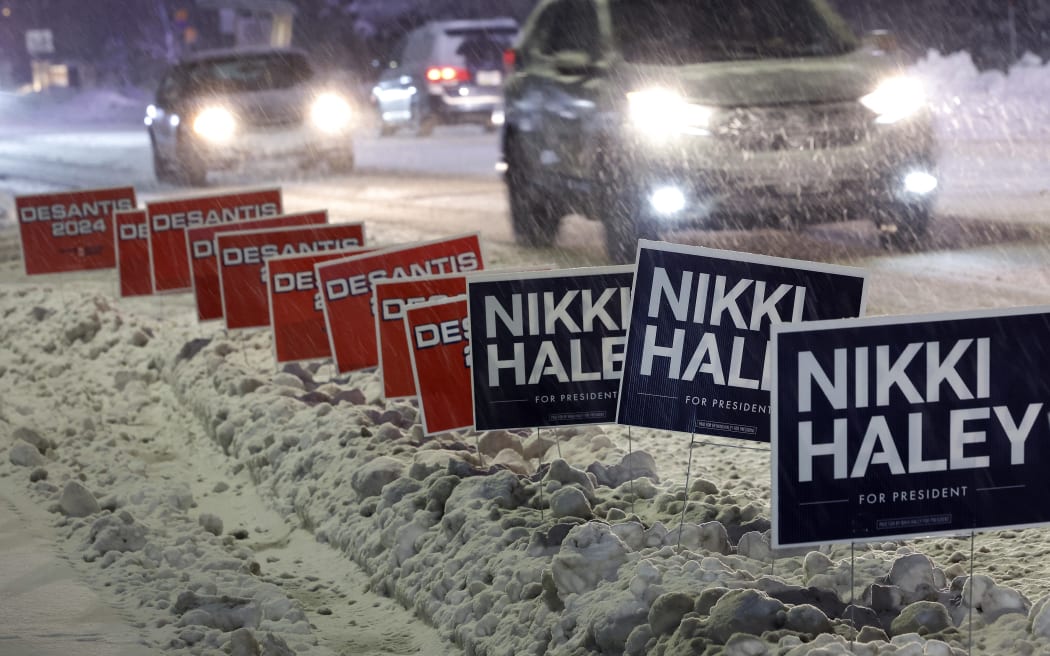 DES MOINES, IOWA - JANUARY 10: Campaign signs for Republican presidential candidates, former U.N. Ambassador Nikki Haley and Florida Gov. Ron Desantis line the road in front of Drake University, where CNN is hosting a presidential debate on January 10, 2024 in Des Moines, Iowa. Haley and Desantis both qualified for this final debate before the Iowa caucuses, while former President Donald Trump declined to participate and instead will hold a simultaneous town hall event live on FOX.   Chip Somodevilla/Getty Images/AFP (Photo by CHIP SOMODEVILLA / GETTY IMAGES NORTH AMERICA / Getty Images via AFP)