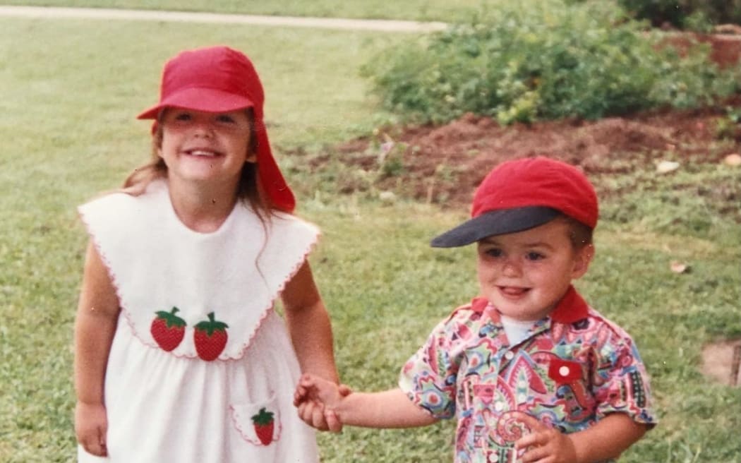 Lech Blaine with his foster sister Hannah in 1994.