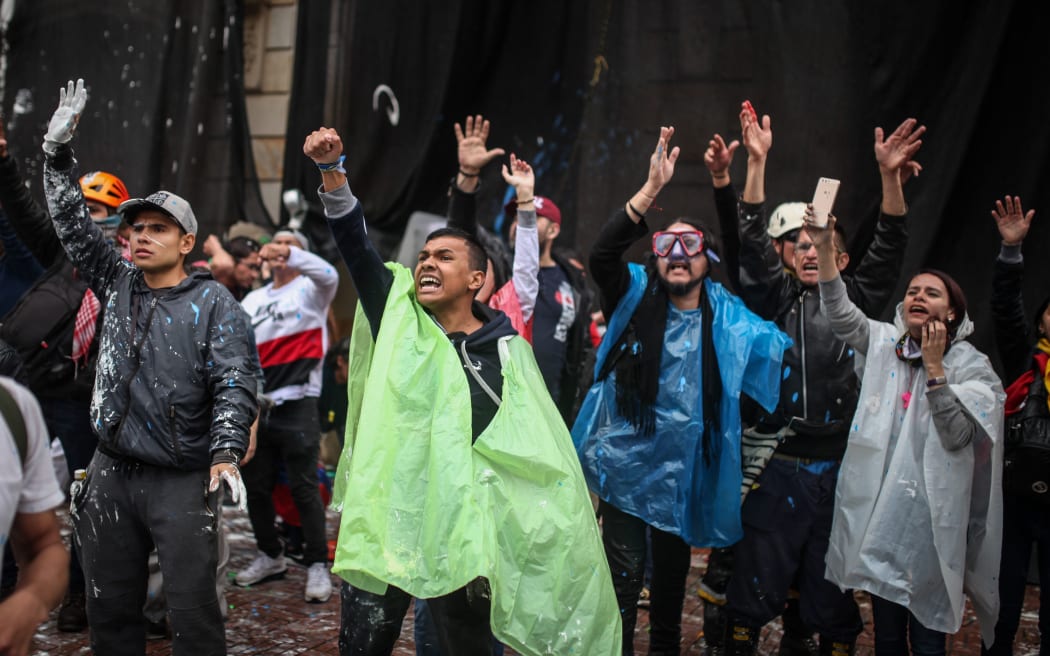 BOGOTA - COLOMBIA, NOVEMBER 21:  Thousands of protesters are seen streamed into the central Bolivar Square in clashes with the Mobile Anti-Disturbances Squadron (ESMAD in Spanish) in Bogota, Colombia on November 21, 2019.