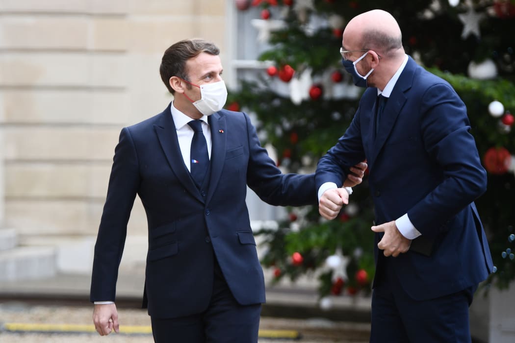 French President Emmanuel Macron (left) welcomes European council president Charles Michel to the Elysee palace on December 14, before a meeting of the OECD.