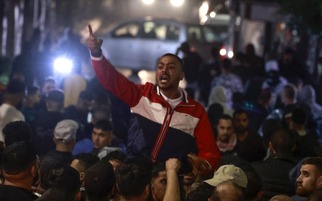 Palestinians in the West Bank city of Ramallah rally in solidarity with the Palestinians of the Gaza Strip after hundreds were killed in a Gaza hospital bombing.