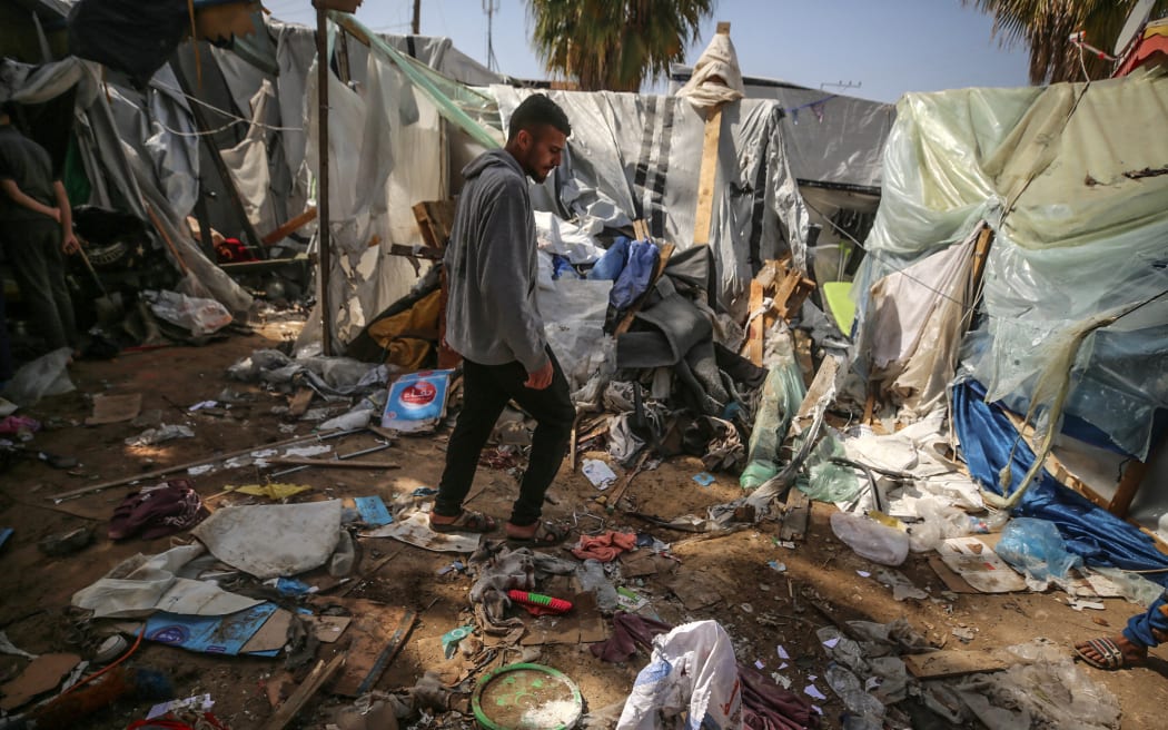Palestinians are checking the damage at a makeshift camp for displaced people in front of the Al-Aqsa Martyrs Hospital in Deir al-Balah in the central Gaza Strip, after it was hit by an Israeli bombardment on March 31, 2024, amid the ongoing battles between Israel and the Hamas militant group. (Photo by Majdi Fathi/NurPhoto) (Photo by MAJDI FATHI / NurPhoto / NurPhoto via AFP)