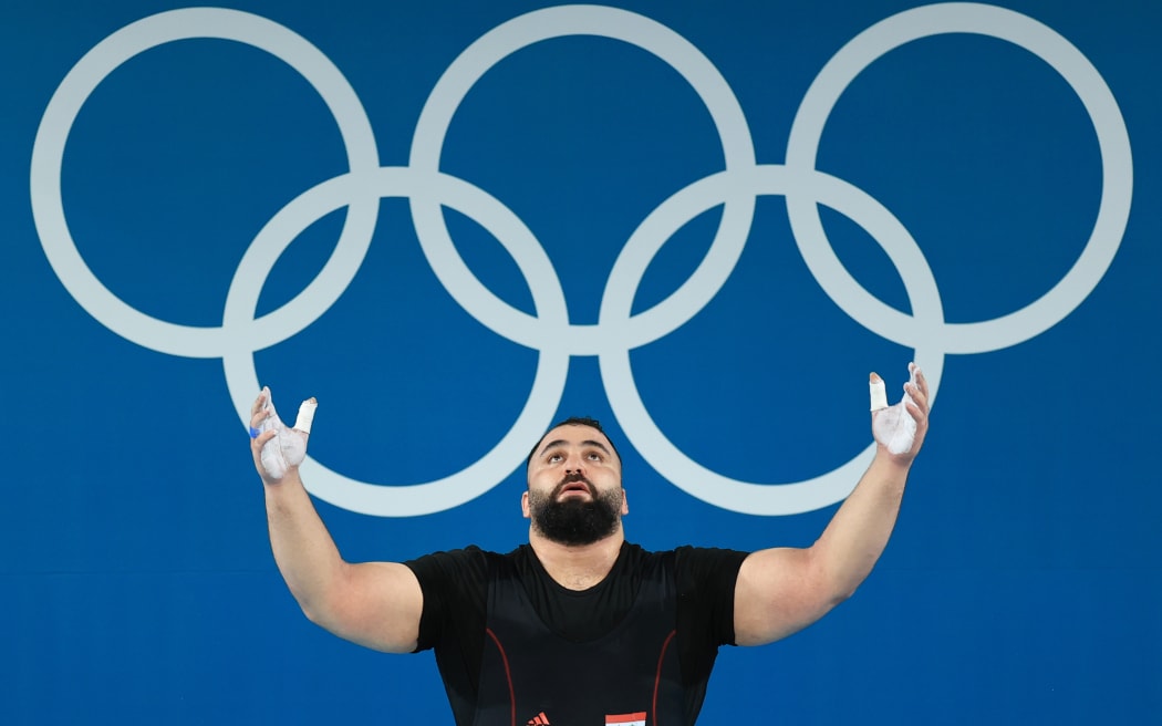 Man Asaad of Syria competes in the 102kg category of the Men's Weightlifting at the 2024 Paris Olympics.