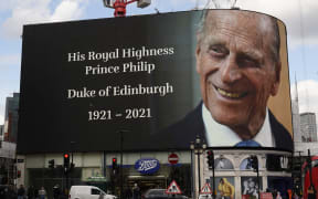 The electronic billboard at Piccadilly Circus displays a tribute to Britain's Prince Philip, Duke of Edinburgh in central London on April 9, 2021 after the announcement of the duke's death.