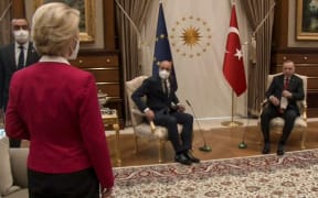 This video frame grab taken from footage released by The Turkish Presidency shows Turkish President Recep Tayyip Erdogan (R) receiving EU Council President Charles Michel (C) and President of EU Commission Ursula von der Leyen (L)