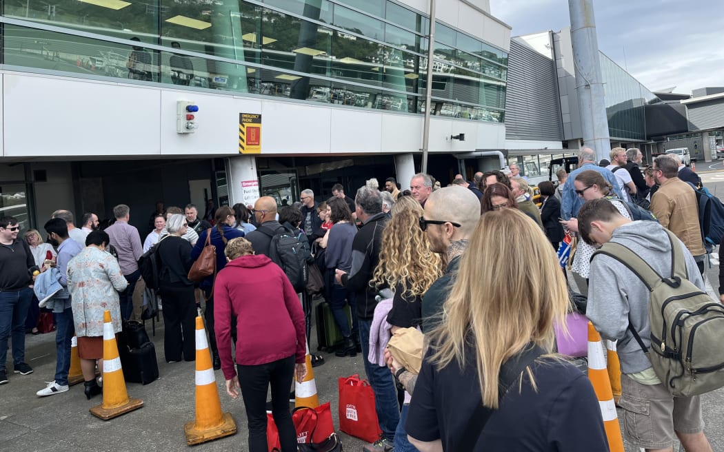 Crowds outside Wellington Airport after it was evacuated.