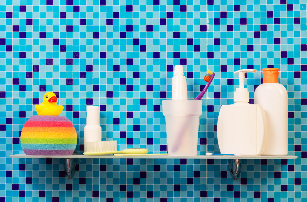 A collection of personal hygiene and body care products, including toothpaste, soap and body wash.