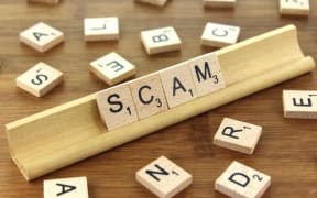 Scam spelled in scrabble