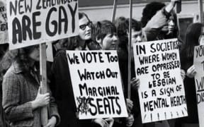 LGBTQI protestors with signs