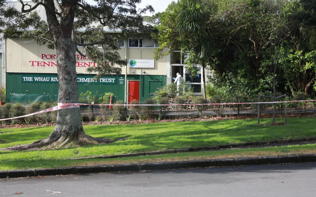 Police entering the scene at the tennis centre in Blockhouse Bay.