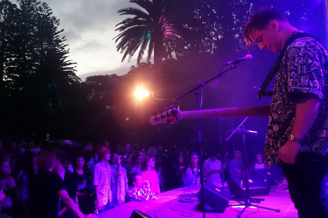 Drax Project bass player Sam Thomson on stage at the Wellington Botanic Garden's Soundshell.