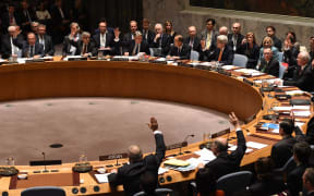 Foreign Ministers vote during a UN Security Council meeting on Syria