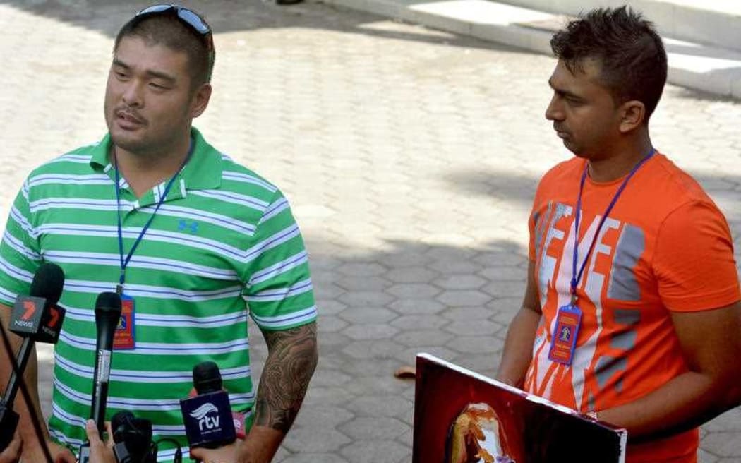 Michael Chan (left), the brother of Andrew Chan, and Chintu Sukumaran, the brother of Myuran Sukumaran, speak to reporters on Tuesday.