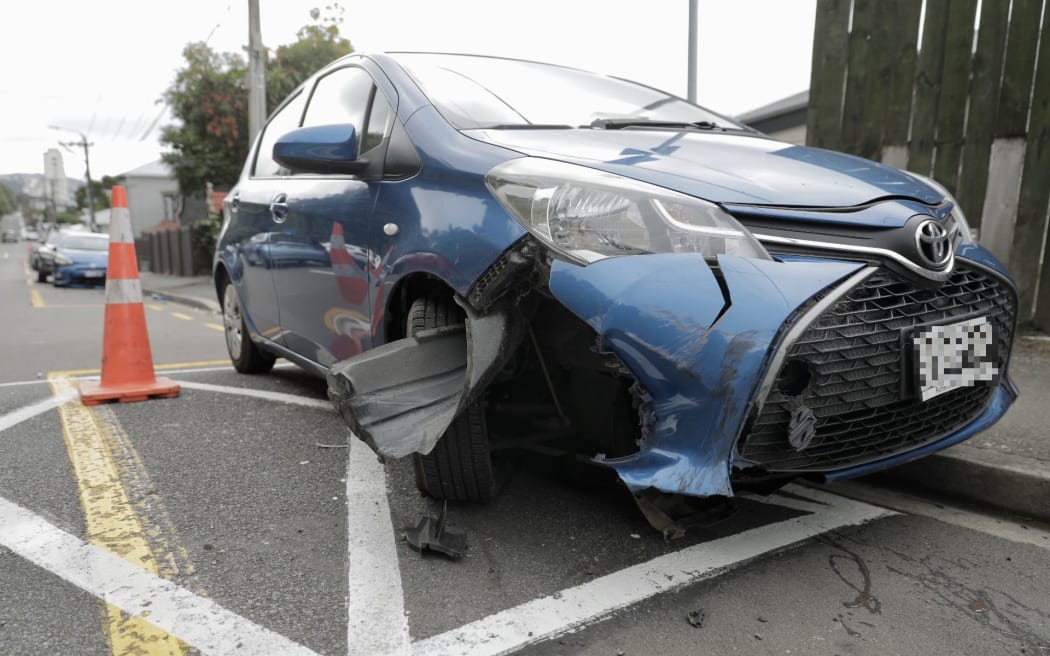 Multiple parked vehicles were damaged by a driver in a stolen vehicle towing a caravan that was fleeing police.