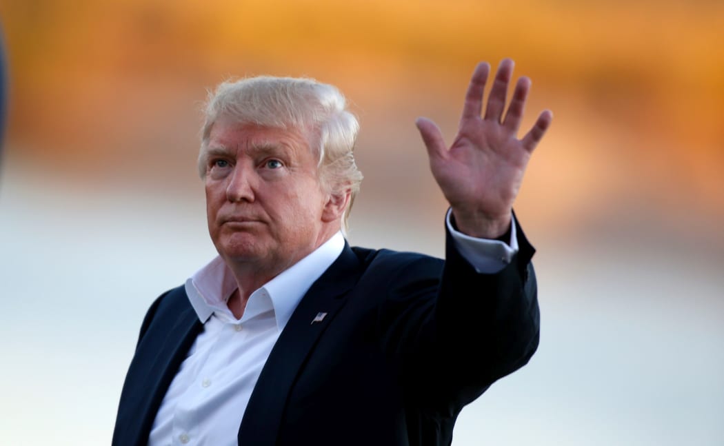 Donald Trump the 45th president of the United States waves to the crowd after the final round of the 2017 Presidents Cup in Jersey City.