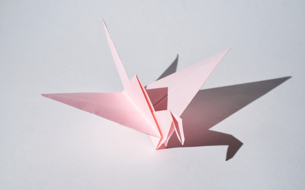 Pink paper origami bird
