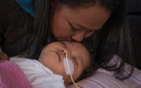 18 month old Moriah with mum Maggie Tu'uinukuafe-Lupeitu'u.  They are appealing against having to return to Tonga where there is limited healthcare available for Moriah.