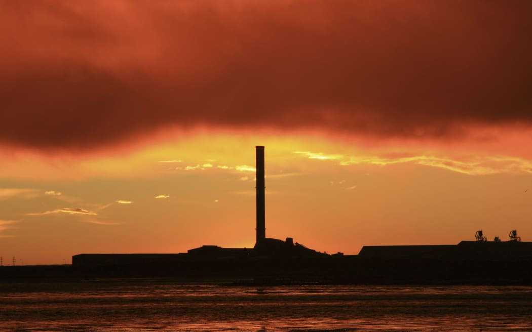 21586193 - a vibrant sunrise overlooking bluff aluminium smelter new zealand