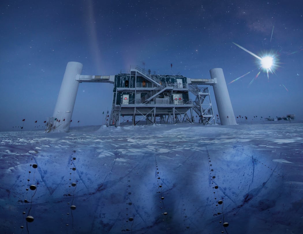 In this artistic composition, based on a real image of the IceCube Lab at the South Pole, a distant source emits neutrinos that are detected below the ice by IceCube sensors, called DOMs.