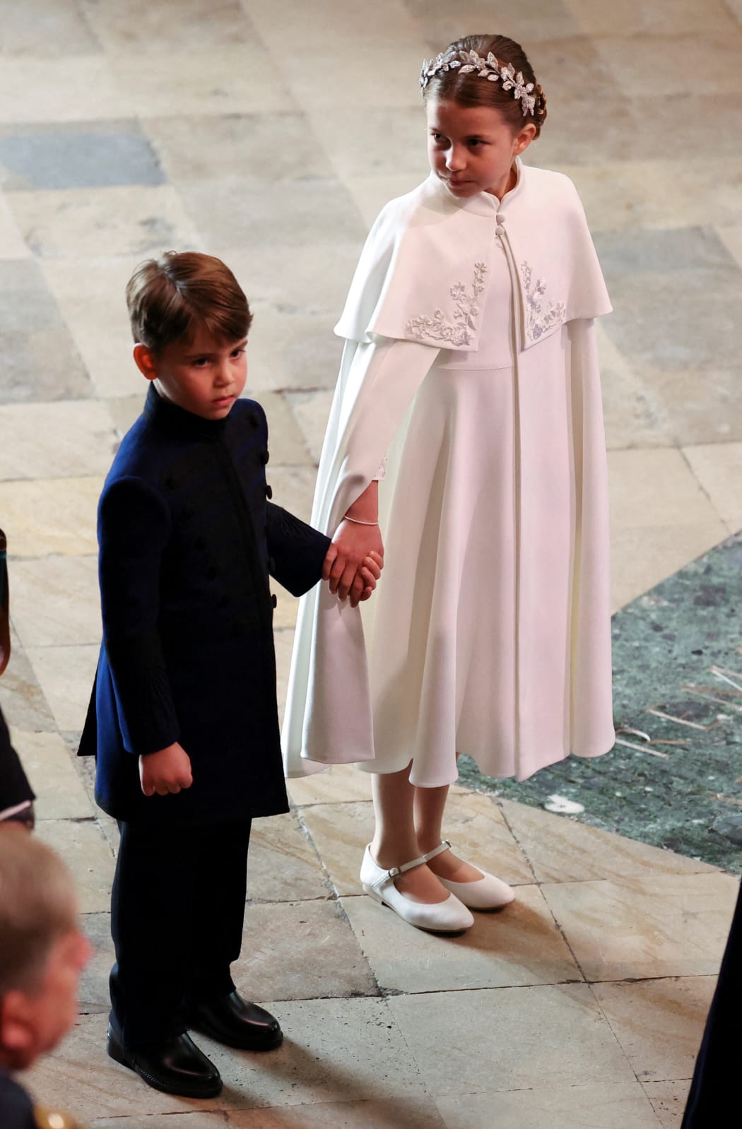 Britain's Princess Charlotte of Wales and Britain's Prince Louis of Wales arrive at Westminster Abbey in central London on May 6, 2023, ahead of the coronations of Britain's King Charles III and Britain's Camilla, Queen Consort. - The set-piece coronation is the first in Britain in 70 years, and only the second in history to be televised. Charles will be the 40th reigning monarch to be crowned at the central London church since King William I in 1066. Outside the UK, he is also king of 14 other Commonwealth countries, including Australia, Canada and New Zealand. Camilla, his second wife, will be crowned queen alongside him, and be known as Queen Camilla after the ceremony. (Photo by PHIL NOBLE / POOL / AFP)