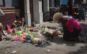 Annette Gibson-Strong visits a memorial to those killed in yesterday's mass shooting in Dayton, Ohio.