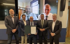 From left, Simon Limmer, Silver Fern Farms, Joel Gabites, ANZCO Foods, Agriculture Minister Damien O’Connor (seated), Ray Smith, Ministry for Primary Industries, Miles Hurrell, Fonterra, (on screen) Dean Fraser, Ngāi Tahu, Garry Diack, Ravensdown.