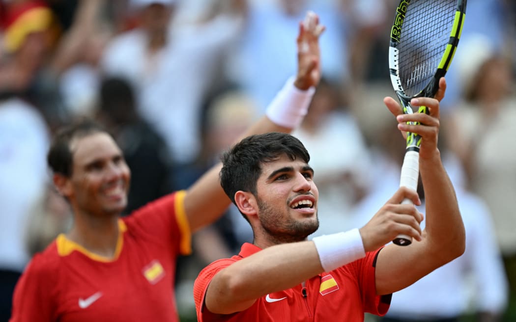 Spain's Carlos Alcaraz (R) and Spain's Rafael Nadal.