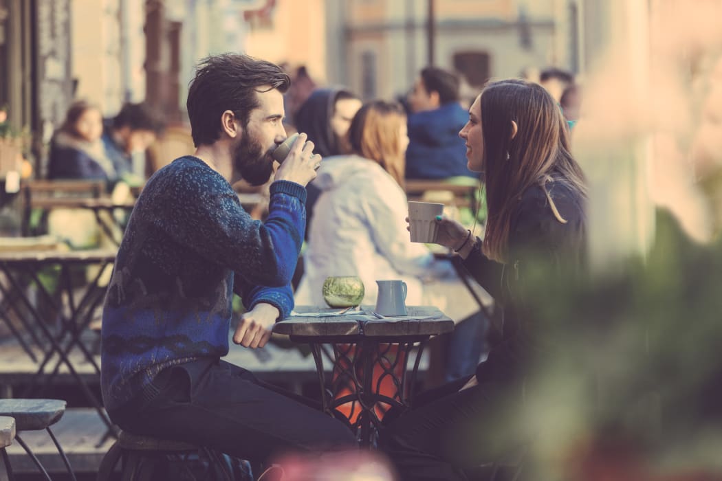 Couple drinking coffee in Stockholm old town.