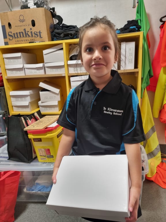 Kids receiving their back-to-school packs.