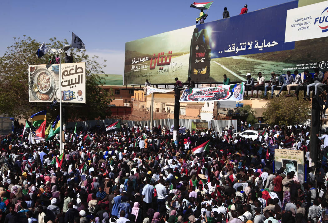 Sudanese protesters rally in front of a court in Omdurman near the capital Khartoum during the trial on December 30, 2019 of intelligence agents for the death of teacher Ahmed Al-Khair while in custody of intelligence services.
