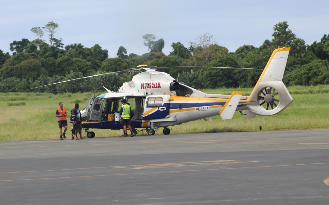 A helicopter landing at Pekoa airport in Santo with ballot boxes from Malikaloi in the middle of South Santo