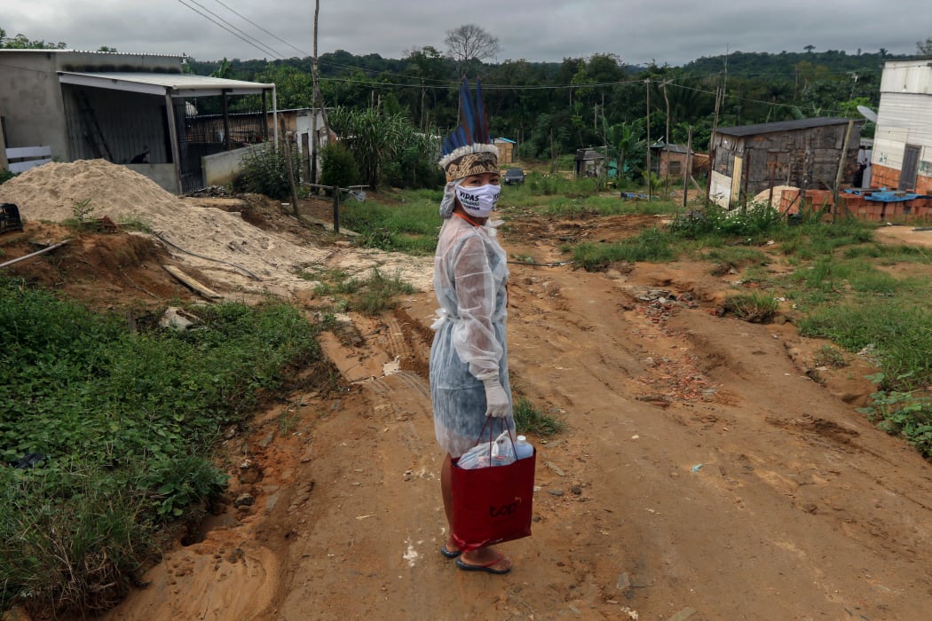 Witoto indigenous nursing assistant Vanda Ortega, 32, starting her round of healthcare visits in the Parque das Tribos, an indigenous community in the suburbs of Manaus, Amazonas State, Brazil, on May 3, 2020 during the Coivd-19 coronavirus pandemic.