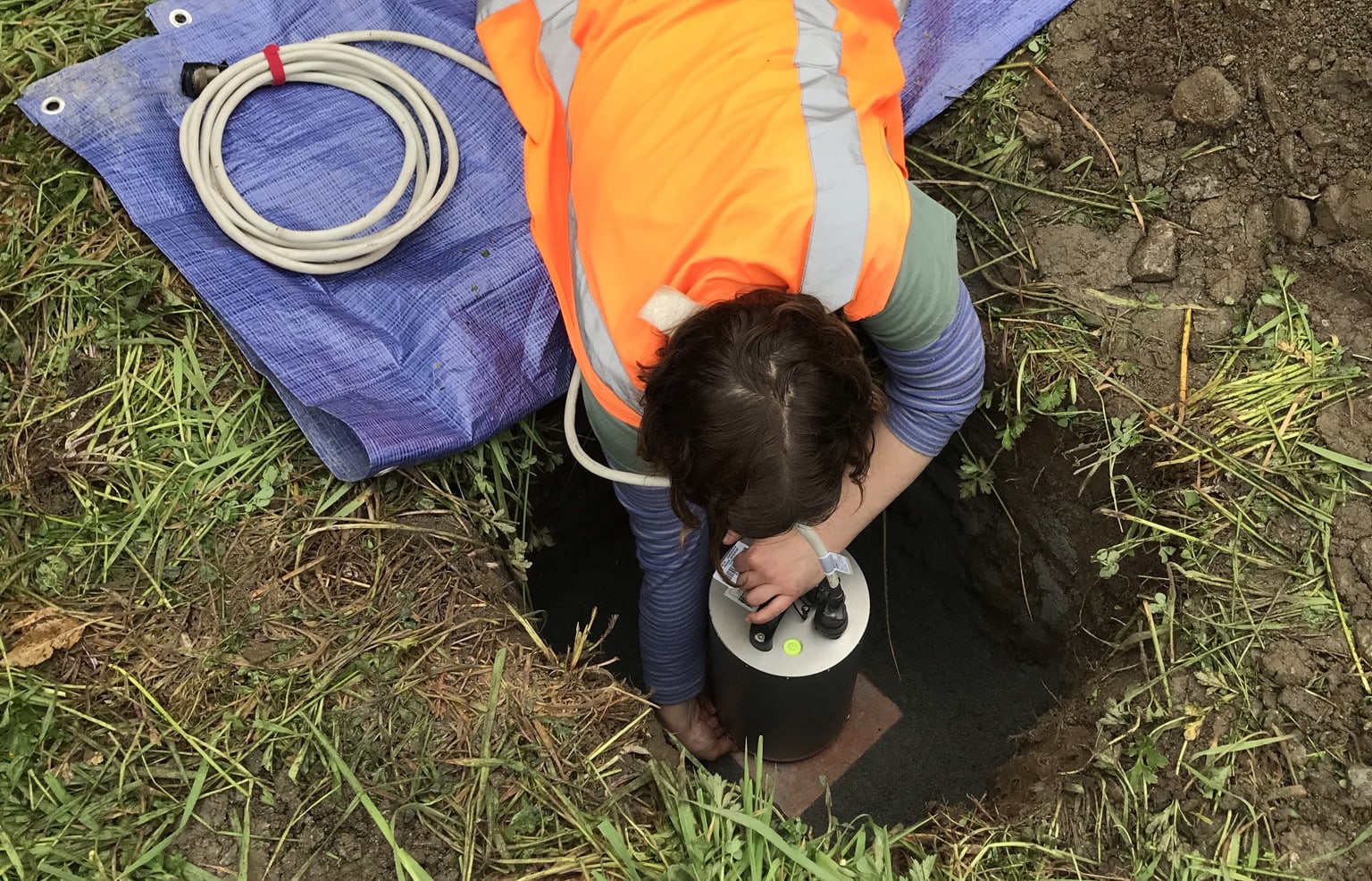 Ash Matheson orientates the sensor in the hole so that it faces North.