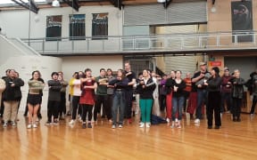 More than 100 staff and students from drama school, Toi Whakaari, gathered to sing the school waiata Toi Whakaari E