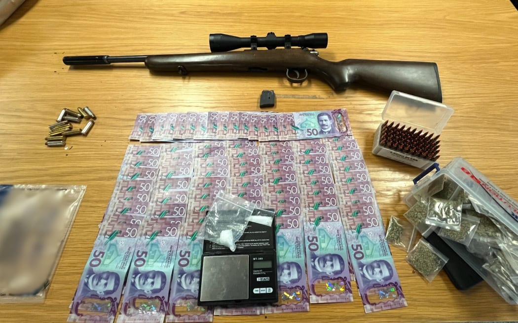 A firearm, ammunition, drugs, cash, and multiple stolen items have been seized by Police.
